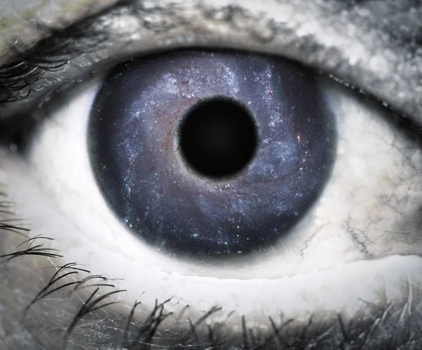 Human eye looking in Universe. — Stock Photo, Image