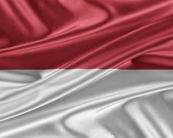Vlajka Indonésie s lesklé hedvábné textury. — Stock fotografie