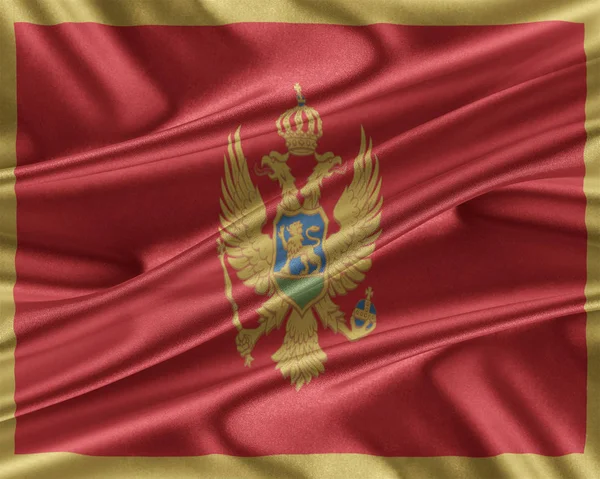 Montenegro flag with a glossy silk texture. — Stock Photo, Image