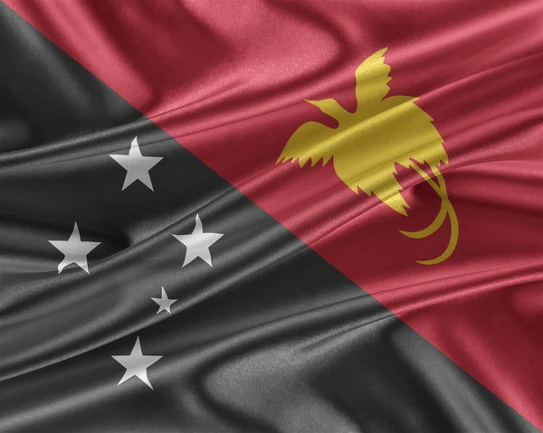 Papua New Guinea flag with a glossy silk texture. — Stock Photo, Image