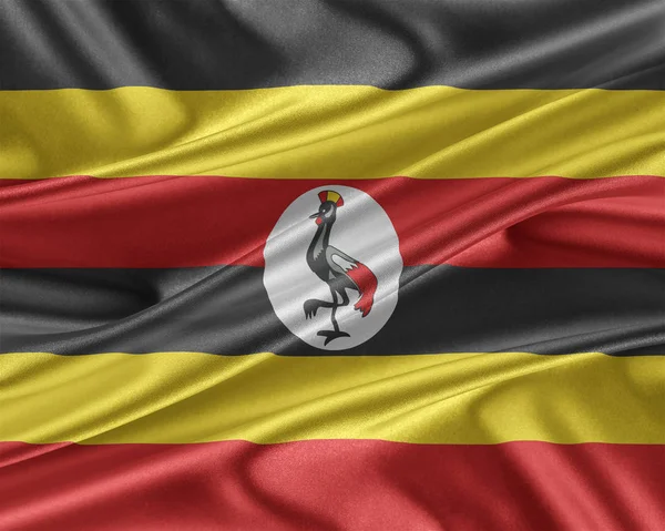 Vlajka Ugandy se lesklé hedvábné textury. — Stock fotografie