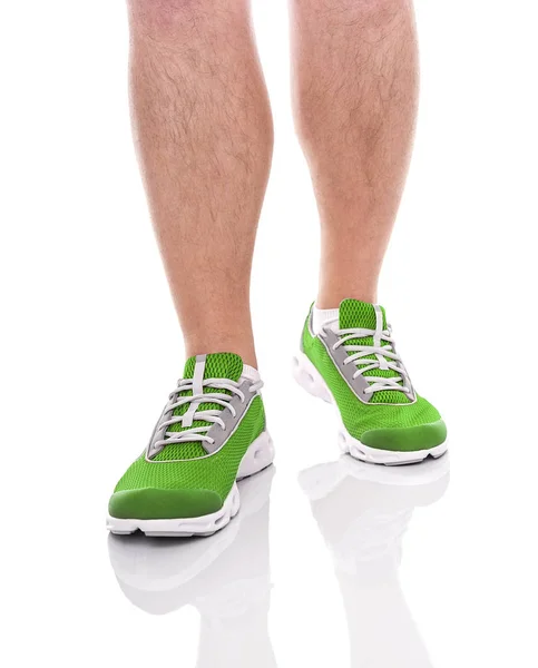 Mens sport benen in sneakers. — Stockfoto