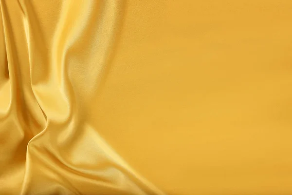 Gold silk satin. — Stock Photo, Image