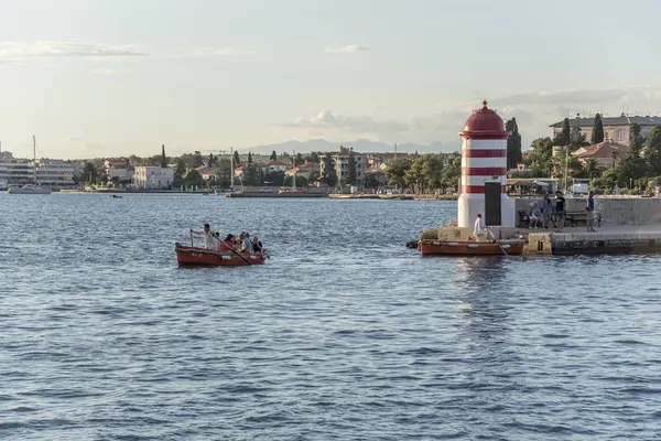 A small lighthouse and pier in the city of Zadar, Croatia. — Stock Photo, Image