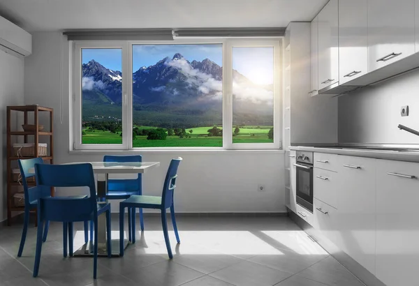 Кухня с белой мебелью и окнами с горными пейзажами . — стоковое фото