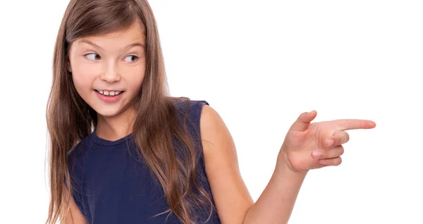 Little girl shows a finger to the side. — Stock Photo, Image