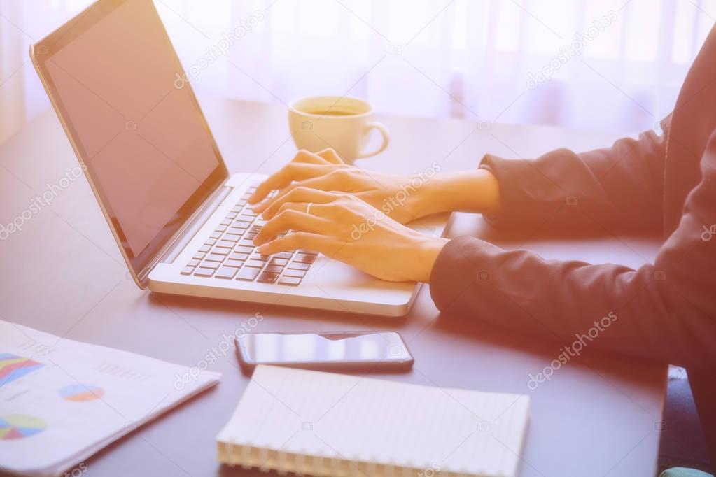 A young business woman using laptop computer.