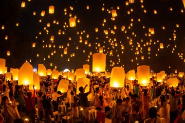 Floating lanterns on sky in Loy Krathong Festival clipart