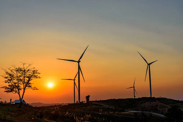 Wind turbine farm over sunset — Stock Photo, Image