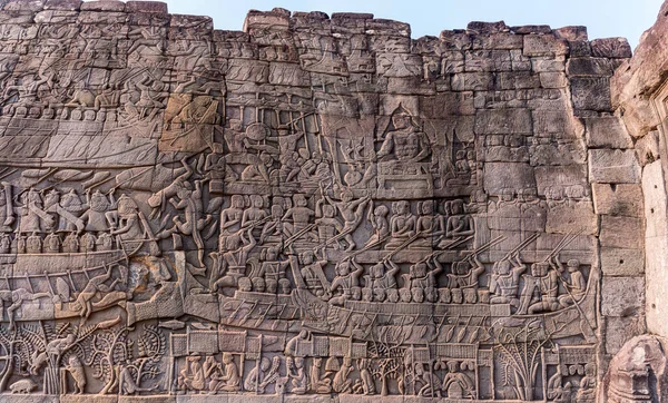 Stone carvings on the walls of the Bayon Temple in Angkor Thom, Siem Reap, Cambodia.