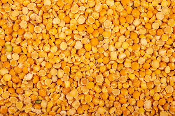 Yellow split peas, the texture of the surface. Traditional cereals for making soups and porridge. Close up — Stock Image Yellow Split Peas Texture Surface Traditional Cereals Making Soups Porridge Stock Image