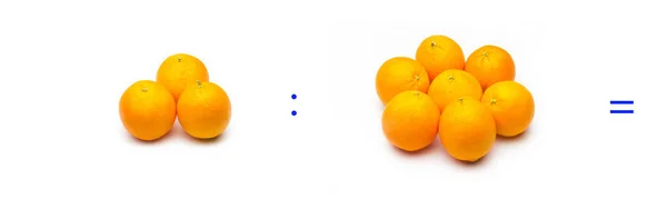 Division, simple mathematical operation; division between oranges — ストック写真