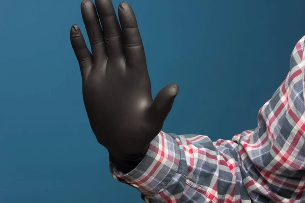 Hygienic hand protection, fine black glove to avoid losing touch in the hands. Hand and finger signs.