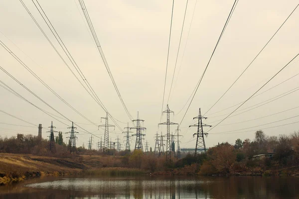 Coal power station in beautiful area full of trees and lake, mirror reflection of energetic pole and power station with chimneys, synergy of industry and nature — Stock Photo, Image