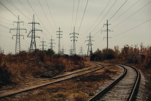 Industrial foggy landscape - old abandoned industrial zone in autumn forest — Stock Photo, Image