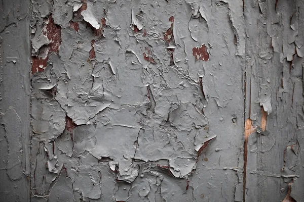 Pared agrietada, pintura blanca pelando una vieja pared interior . —  Fotos de Stock