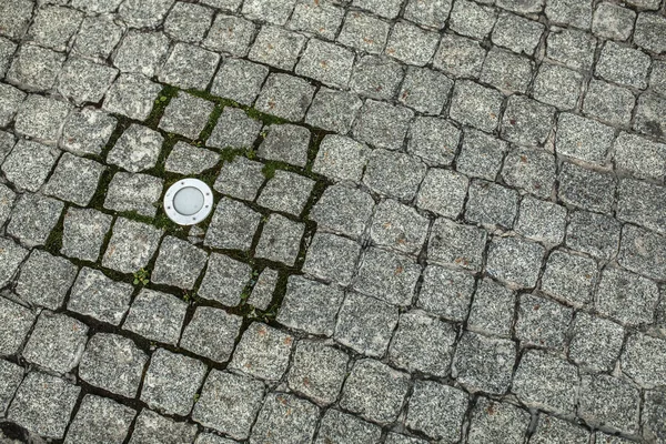 Granit grå kullerstensbelagda trottoaren abstrakt bakgrund — Stockfoto