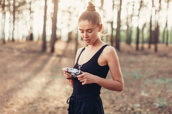 Hipster girl with using vintage photo camera close up, copy space of blank empty mockup, view tourist holding in hands and photograph on device travel on background — Stock Photo, Image