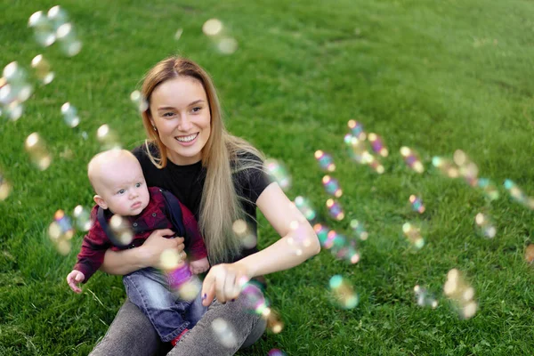 Young Caucasian Mother Inflates Soap Bubbles Her Little Son Park — Stock Photo, Image