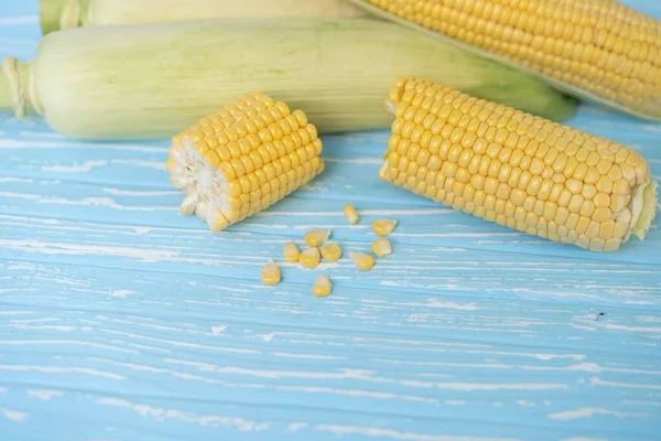 Corn Cob Green Leaves Lies Table Blue Color Background Copy — Stock Photo, Image