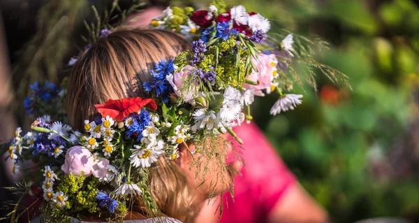 summer solstice wreath on head, handmade, individual parts in focus, summer day