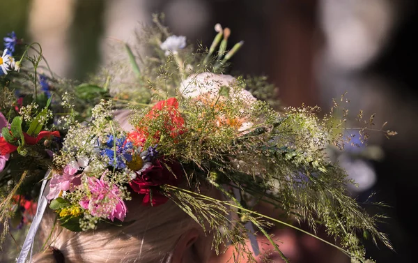 summer solstice wreath on head, handmade, individual parts in focus, summer day