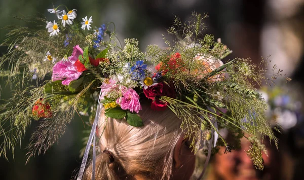 summer solstice wreath on head, handmade, individual parts in focus, summer day