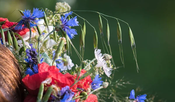 summer solstice wreath on head, handmade, individual parts in focus, summer day