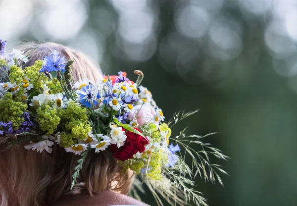 summer solstice wreath on head, handmade, individual parts in focus, summer day