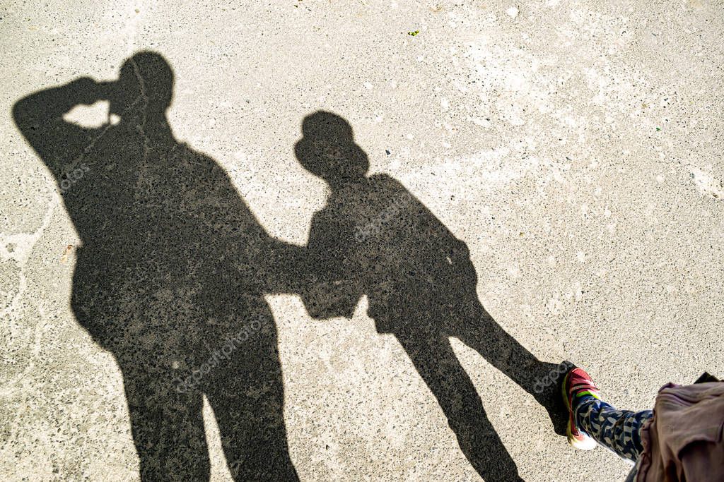 Photo of shadows of father and daughter