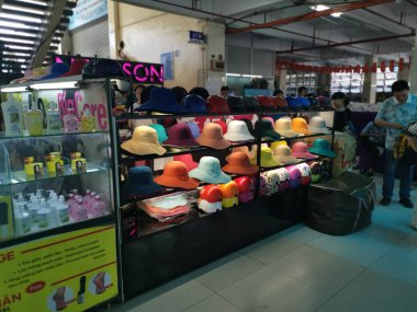 Ho Chi Minh City, Vietnam - December 15, 2019: Scene of stalls selling variety nuts, junk foods and jewellery are displayed and sold inside the Tong Thau APG Market at Ho Chi Minh City.