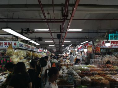 Ho Chi Minh City, Vietnam - December 15, 2019: Scene of stalls selling variety nuts, junk foods and jewellery are displayed and sold inside the Tong Thau APG Market at Ho Chi Minh City.