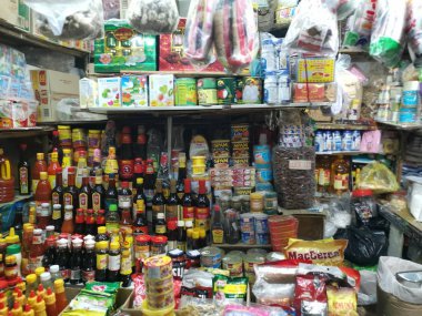 Ho Chi Minh City, Vietnam - December 15, 2019: Scene of stalls selling variety nuts, junk foods and jewellery are displayed and sold inside the Tong Thau APG Market at Ho Chi Minh City.