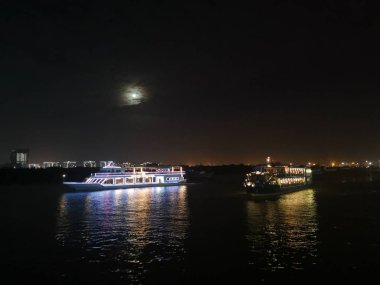 Ho Chih Minh, Vietnam. December 15,2019: A colorful boats restaurant on Bang Dang port, Saigon River.