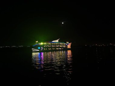 Ho Chih Minh, Vietnam. December 15,2019: A colorful boats restaurant on Bang Dang port, Saigon River.