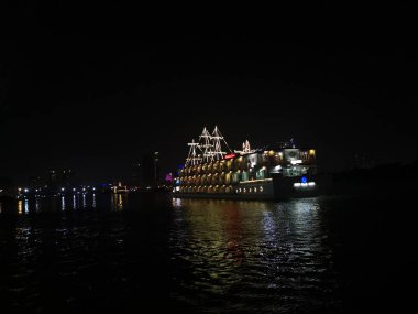 Ho Chih Minh, Vietnam. December 15,2019: A colorful boats restaurant on Bang Dang port, Saigon River.