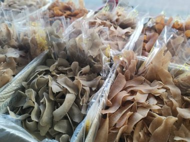 Perak, Malaysia. February 13,2020: Varieties of dried Asian seafood or snacks on displayed on shelves for sale at Pangkor Dried Seafood Supermarket.
