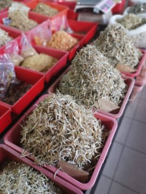Perak, Malaysia. February 13,2020: Varieties of dried Asian seafood or snacks on displayed on shelves for sale at Pangkor Dried Seafood Supermarket.