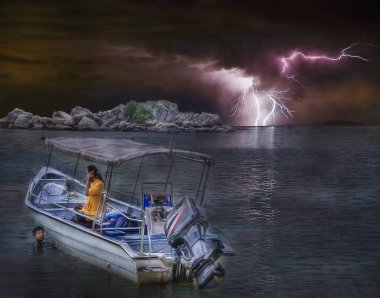 Perak, Malaysia. February 1,2020: Scene of speedboat stranded at the sea during the thunderstorm at Pangkor Island clipart