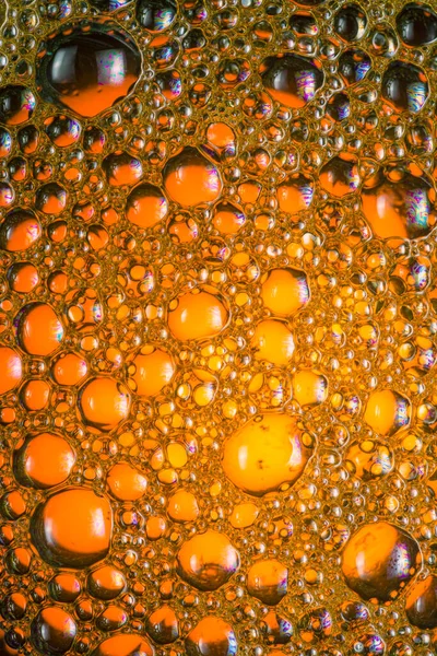 多彩的油滴在水面上飘浮的艺术 — 图库照片