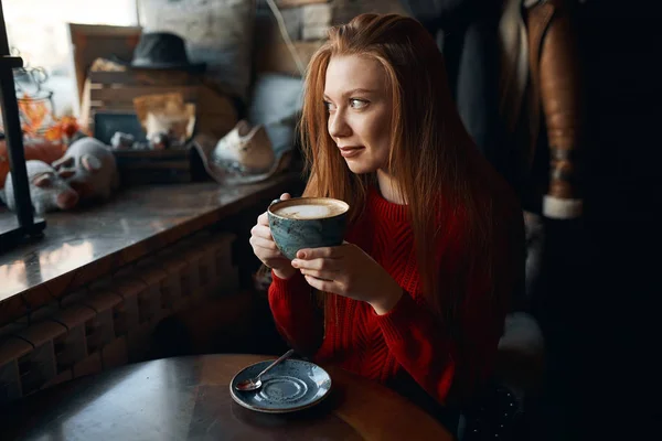 Gorgeous good looking girl in stylish sweater having a rest — Stock Photo, Image