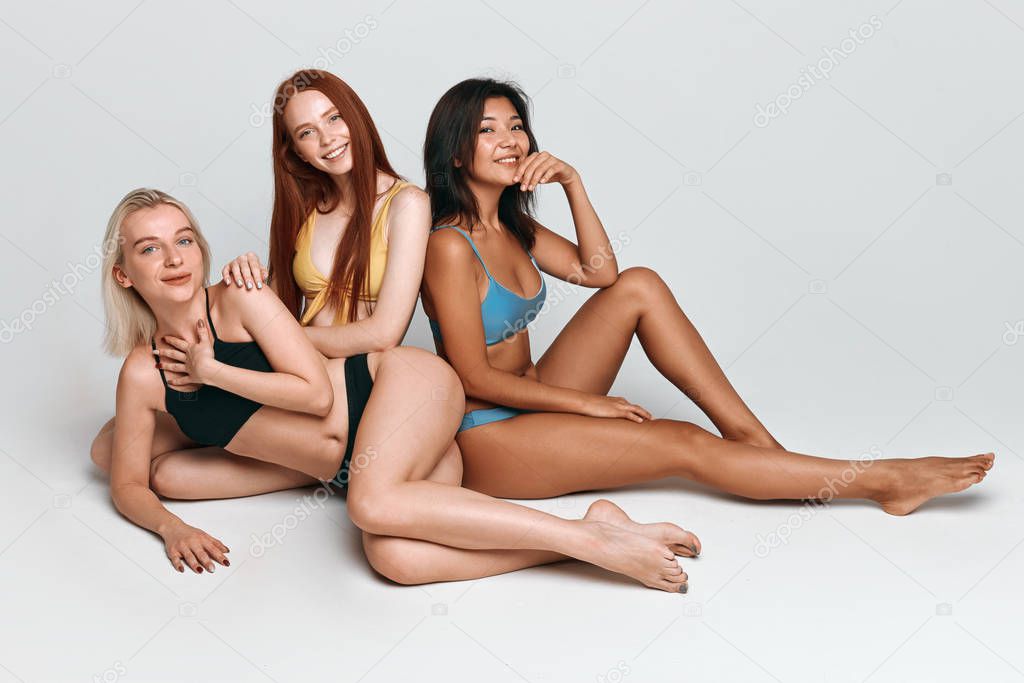 glamorouse mixed race girls having a rest after swimming