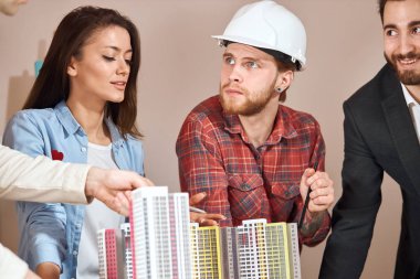 young man and his team working on a building complex Prototype Project,