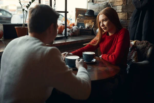 Couple in love enjoying yummy coffee in cafe — Zdjęcie stockowe