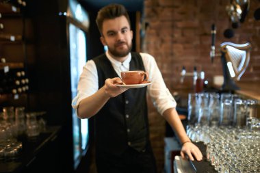 presentataion of tasty coffee drink, good looking guy adivise tea