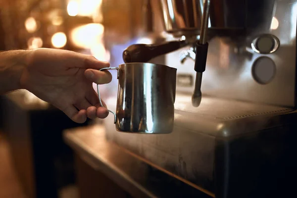 guy prepares morning delicious coffee using coffee machine. The