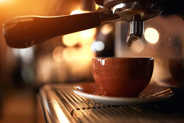 Coffee maker with white orange cup and soucer — Stok fotoğraf