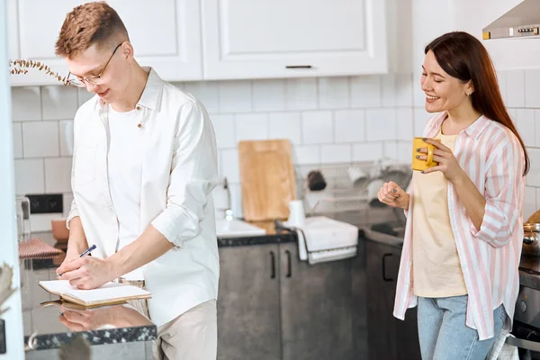 Pleasant woman laughing at her boyfriend — Stockfoto