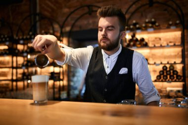 young barista working at coffee shop