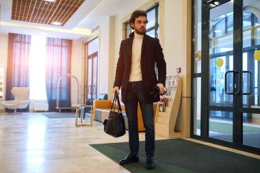young handsome businessman arrived in the hotel, travel business trip